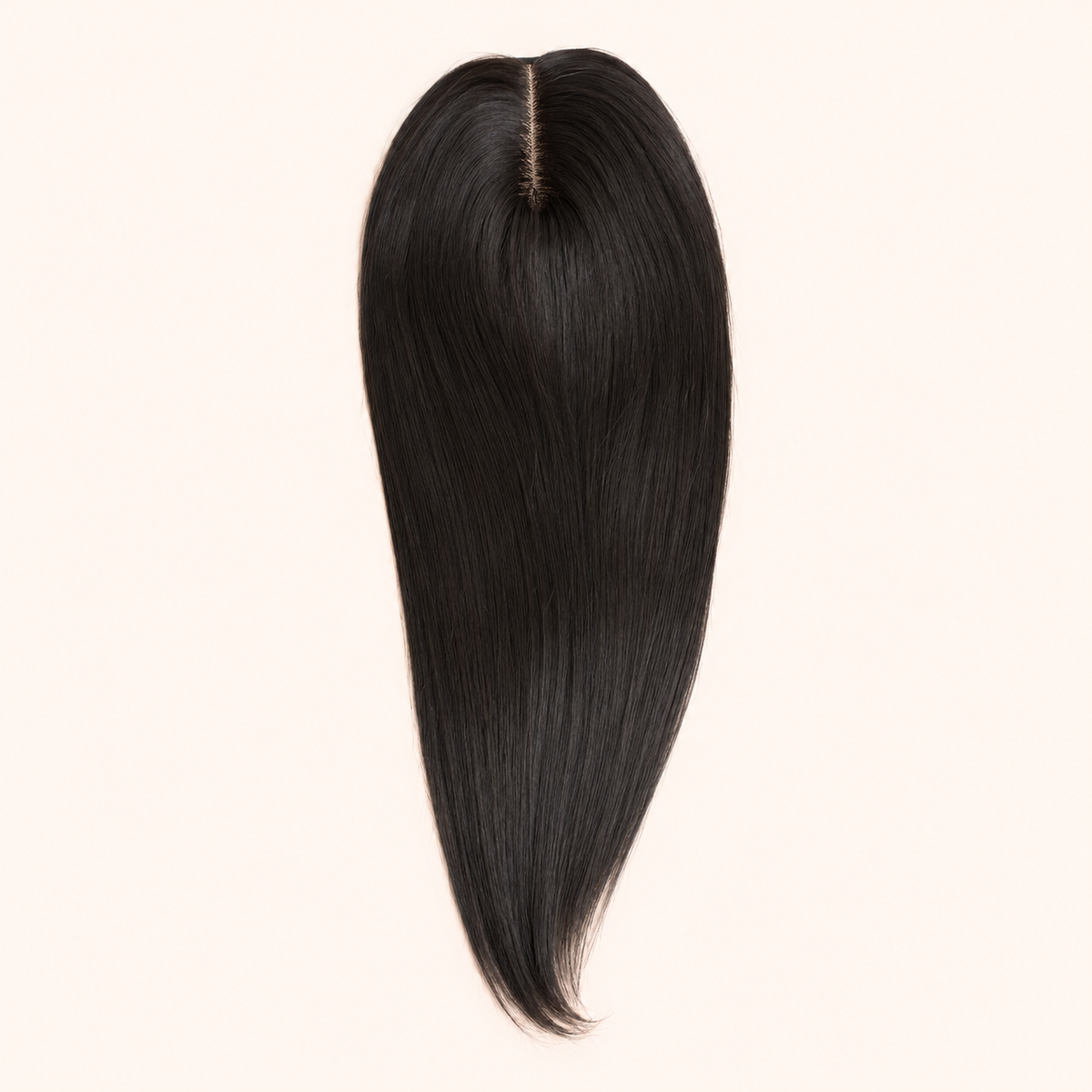 Natural-black CrownLift 20-inch mono topper with centre part on a warm ivory background