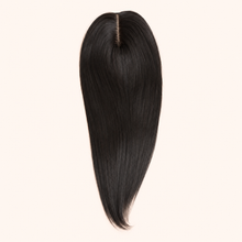 Natural-black CrownLift 20-inch mono topper with centre part on a warm ivory background