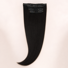 Natural-black Essential Luxe 10-Clip hair extension set with snap clips visible